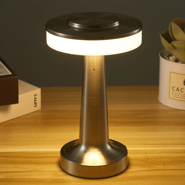 Table lamp on a wooden surface with a dark background