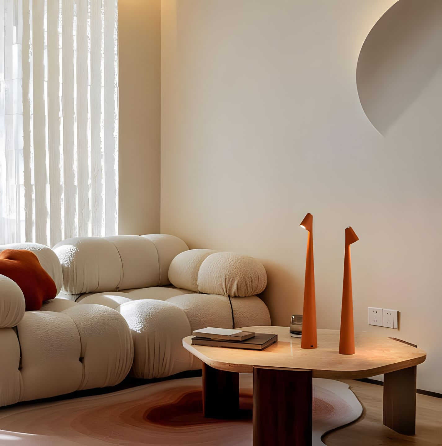 Modern living room with a beige sofa, wooden coffee table, and decorative vases.