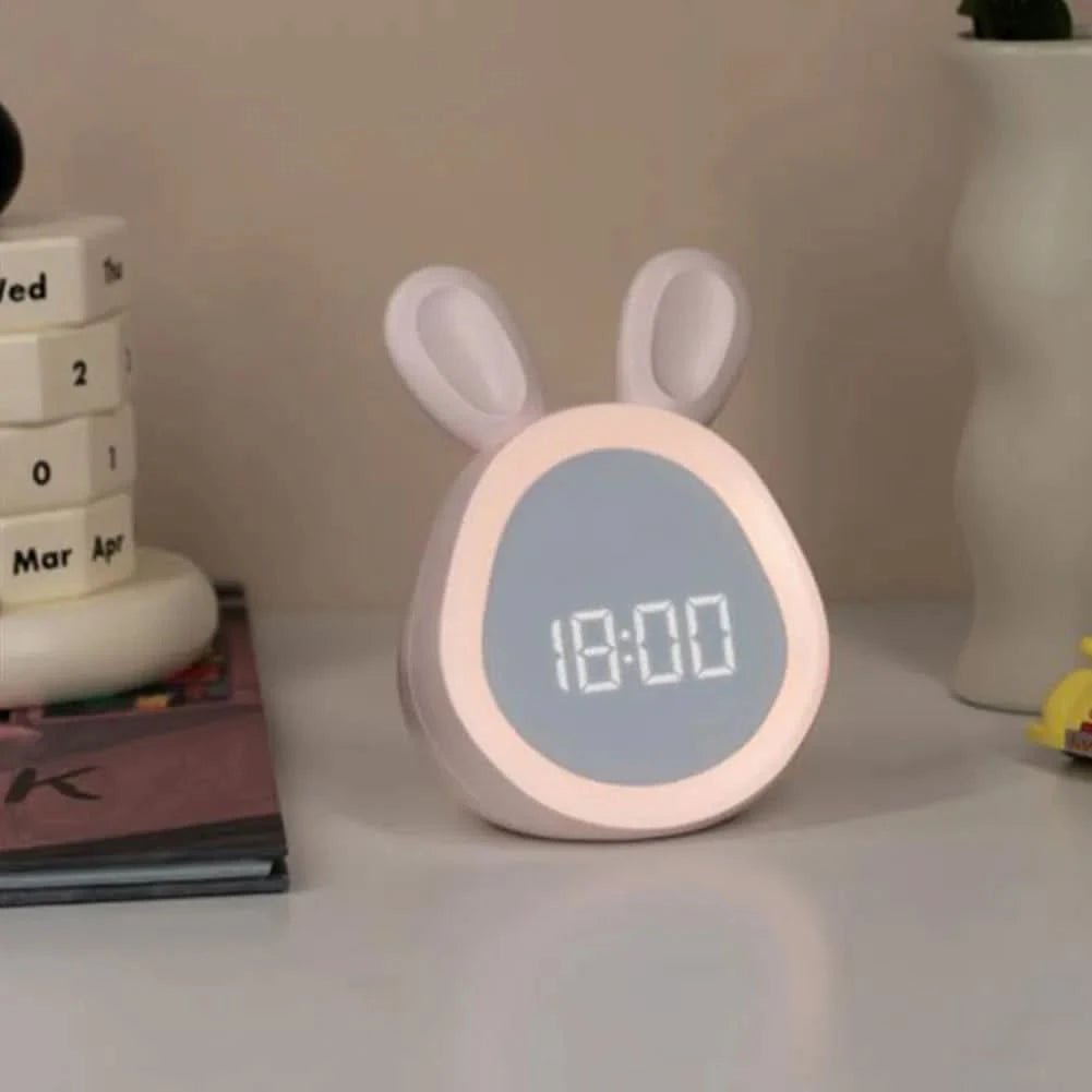 Children's clock with rabbit design on a shelf