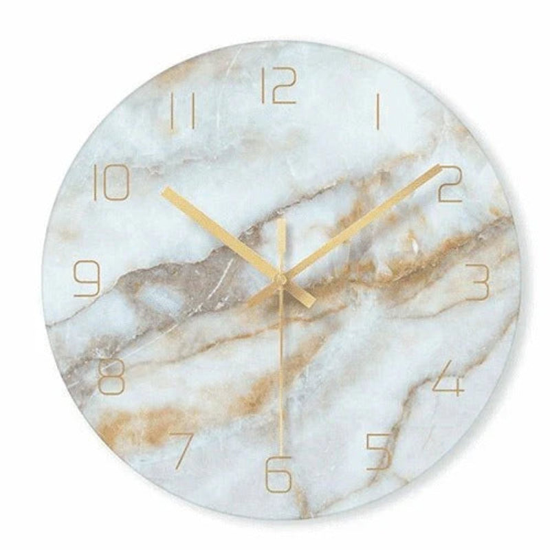 Marble-patterned wall clock with gold hands on a white background