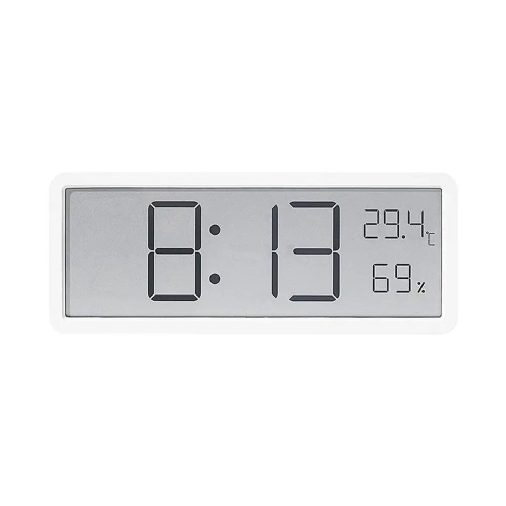 Digital clock with time, temperature, and humidity display on a white background