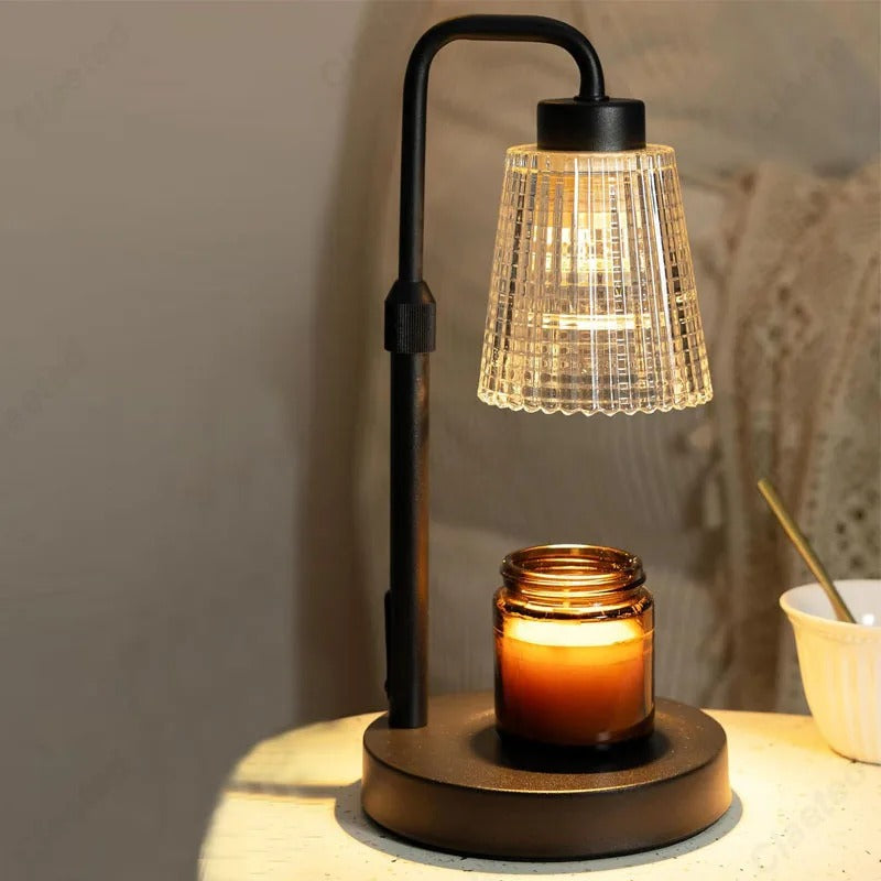 Decorative table lamp with a candle on a wooden surface