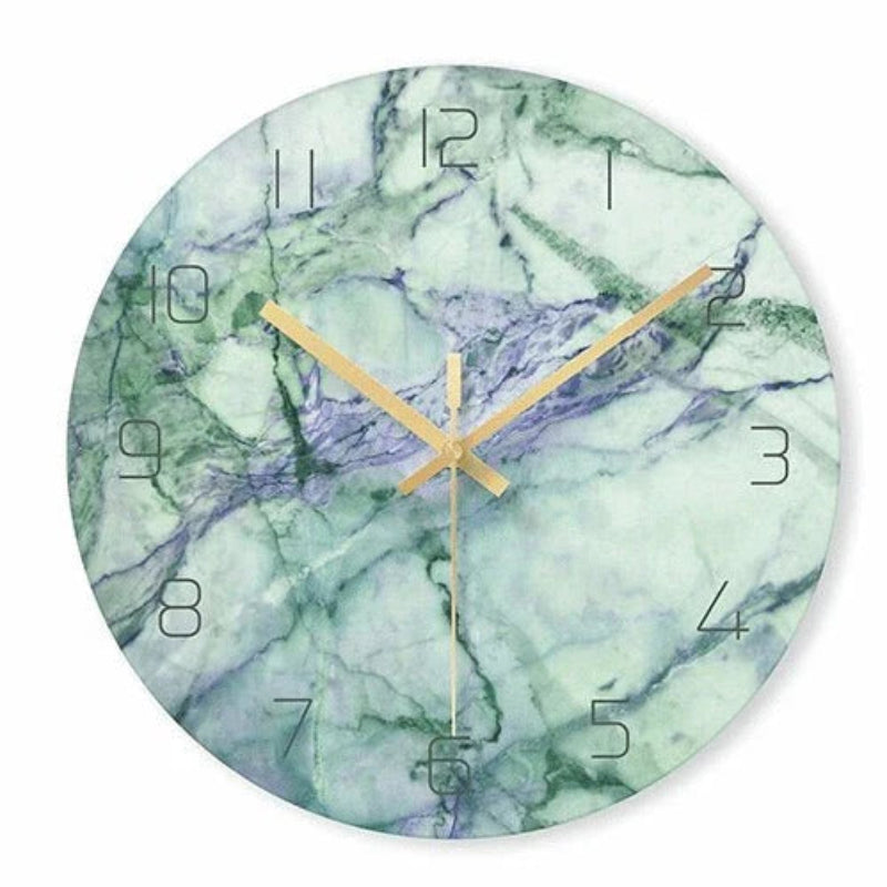 Marble-patterned clock with gold hands on a white background