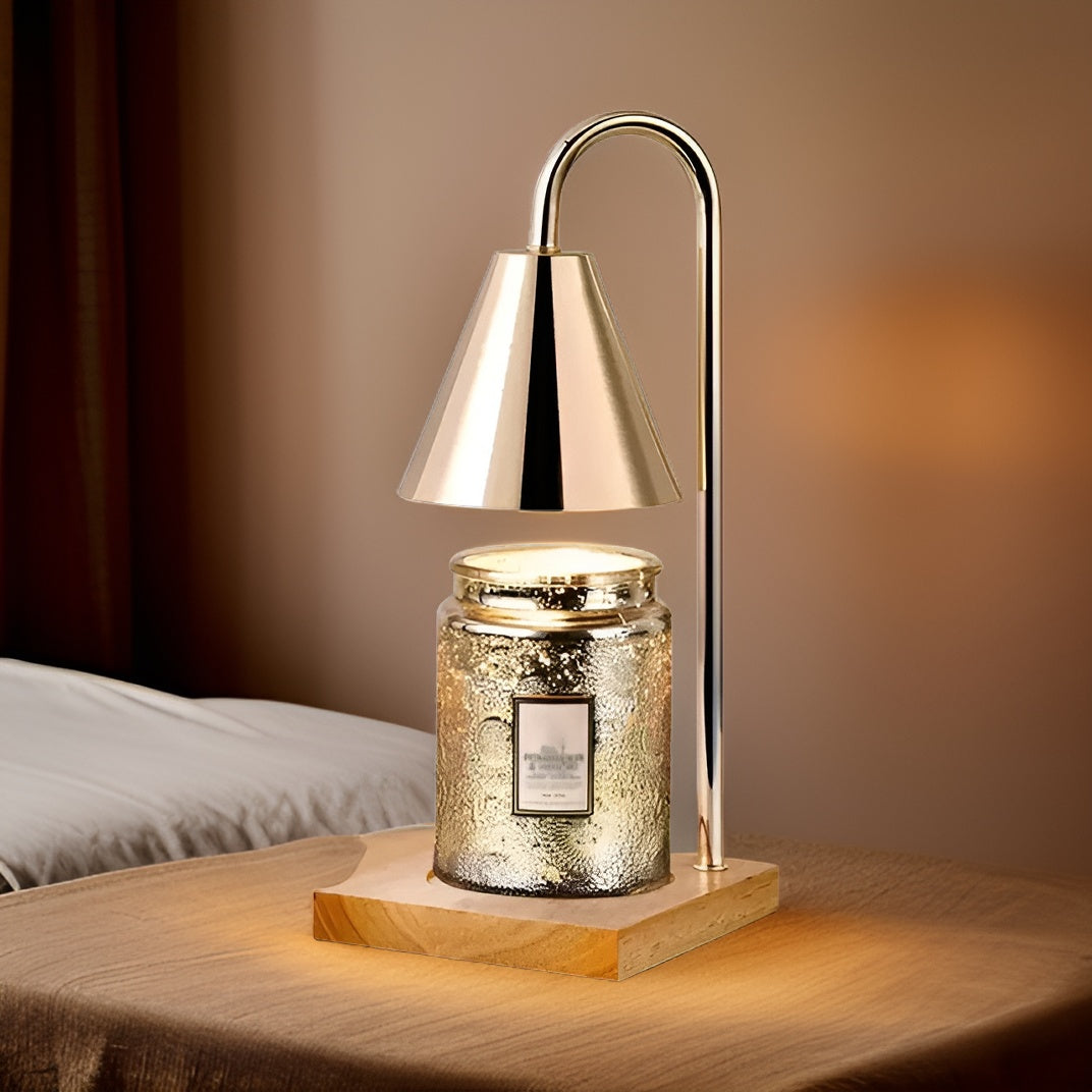 Decorative table lamp with a glass jar base on a wooden surface.