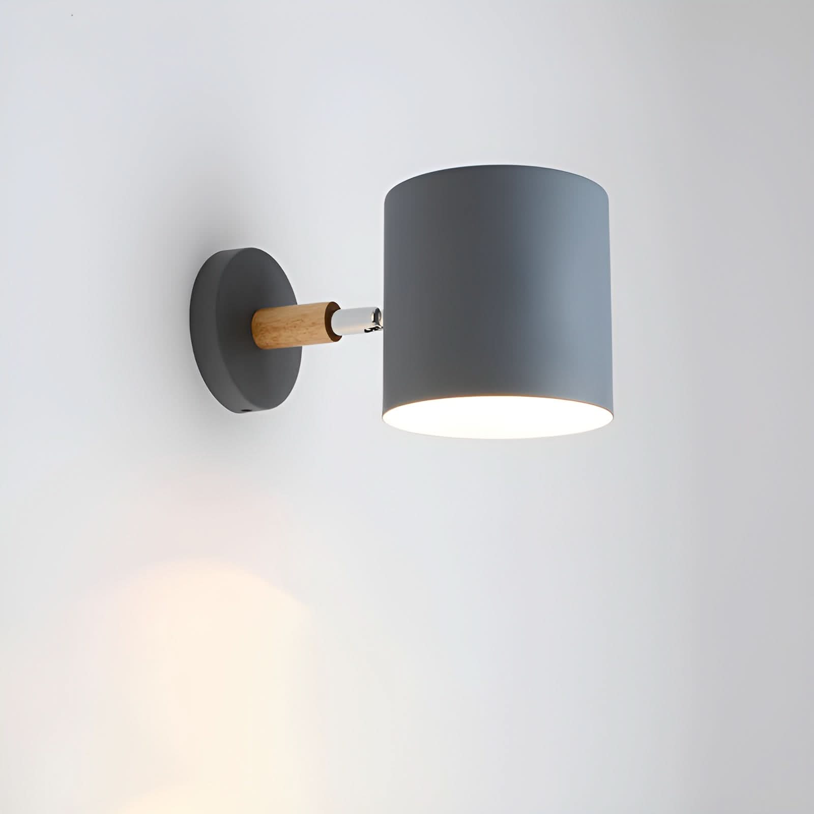 Wall-mounted lamp with a dark gray shade and wooden accent on a light gray background