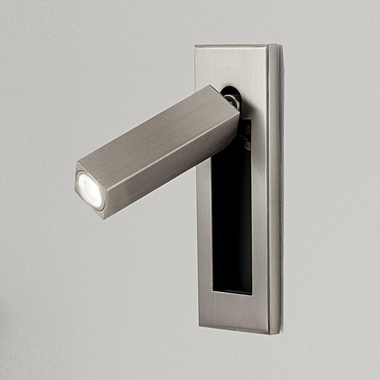 Metallic door handle with light on a gray background