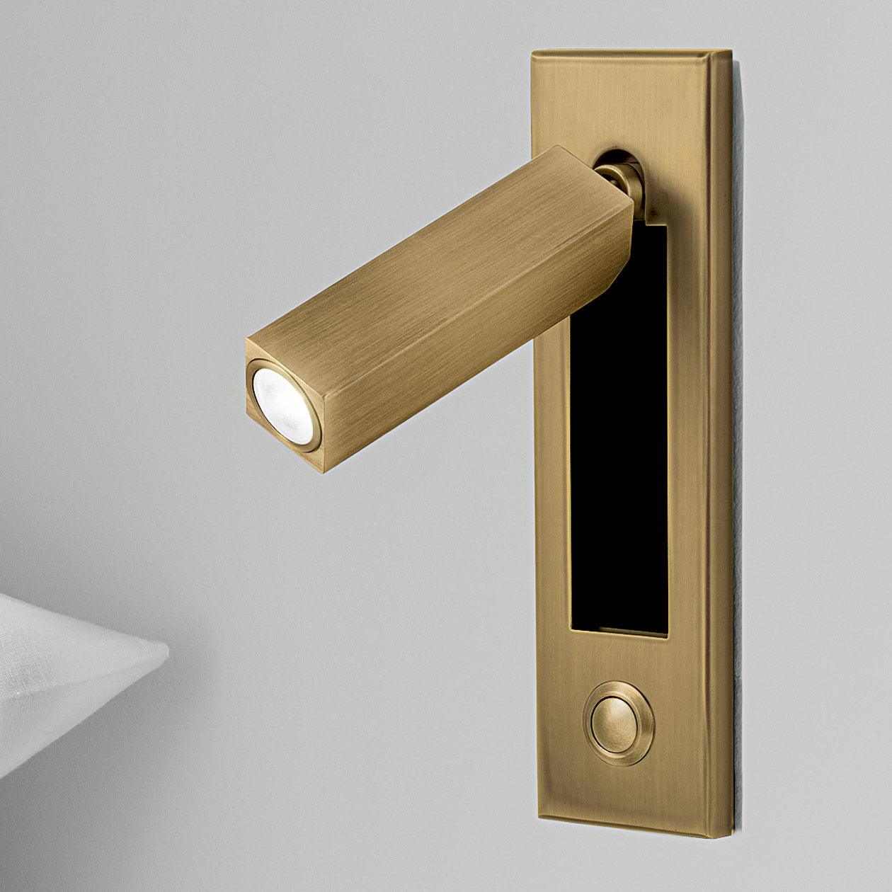 Brass door handle with light on a gray background