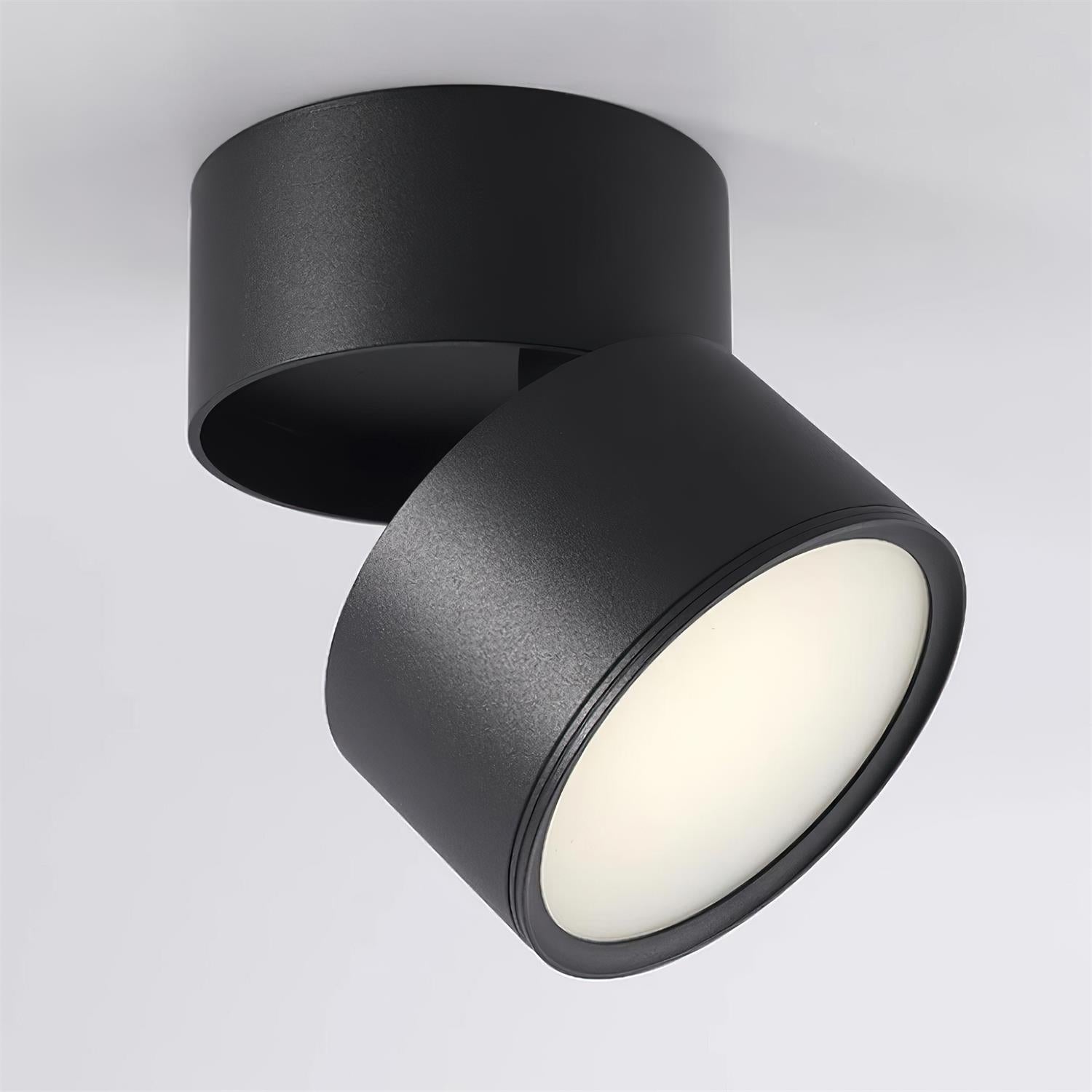 Black ceiling light fixture with a white light on a gray background