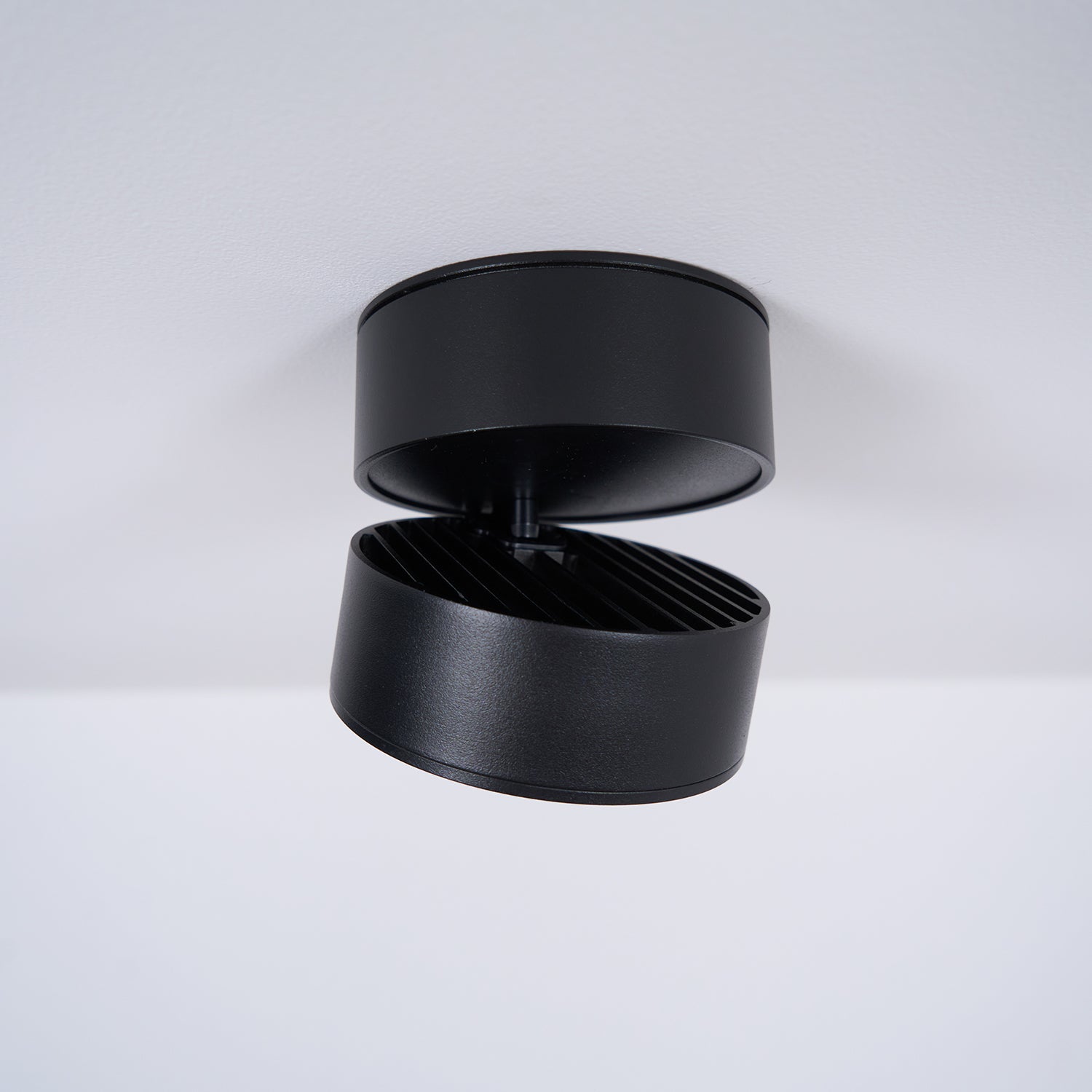 Black cylindrical product on a white background
