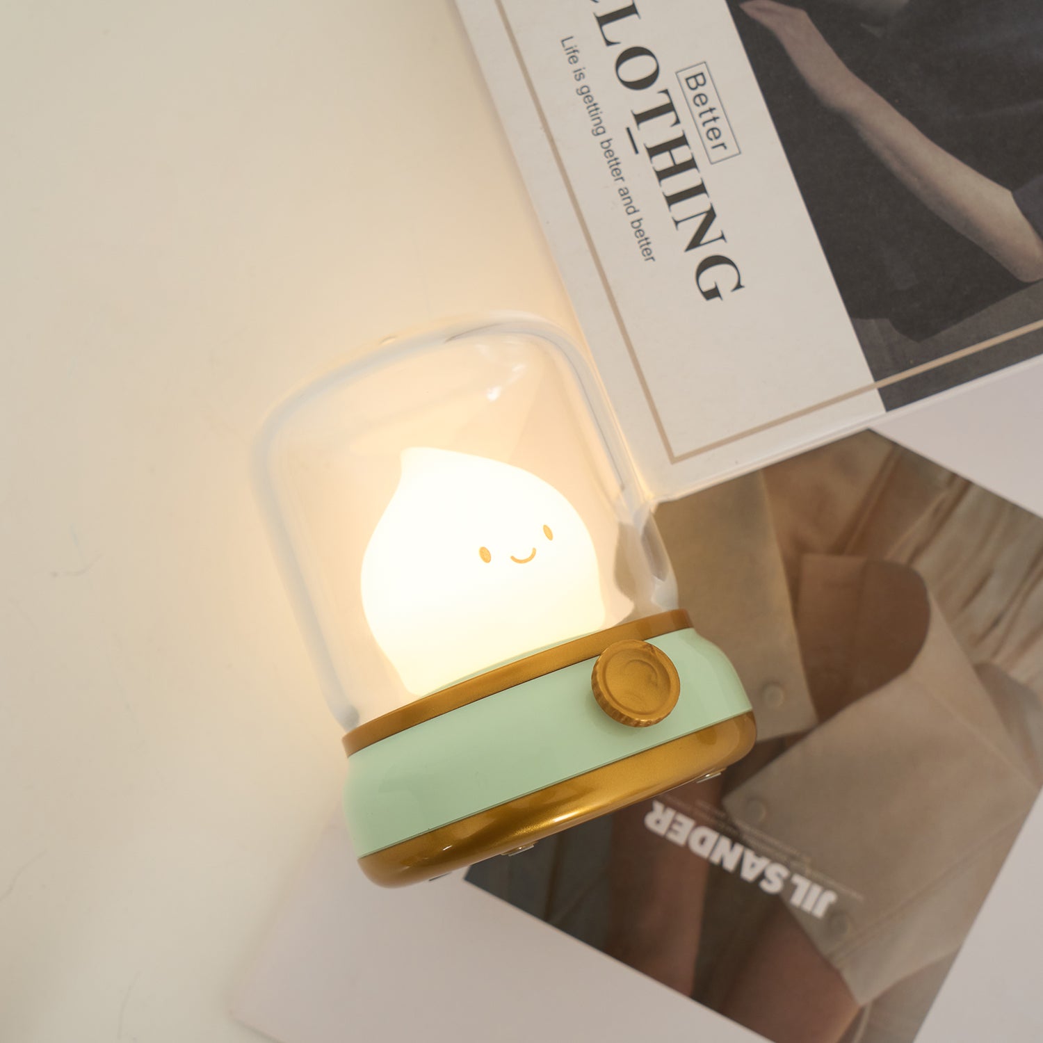 Cute night light with a smiling face on a shelf