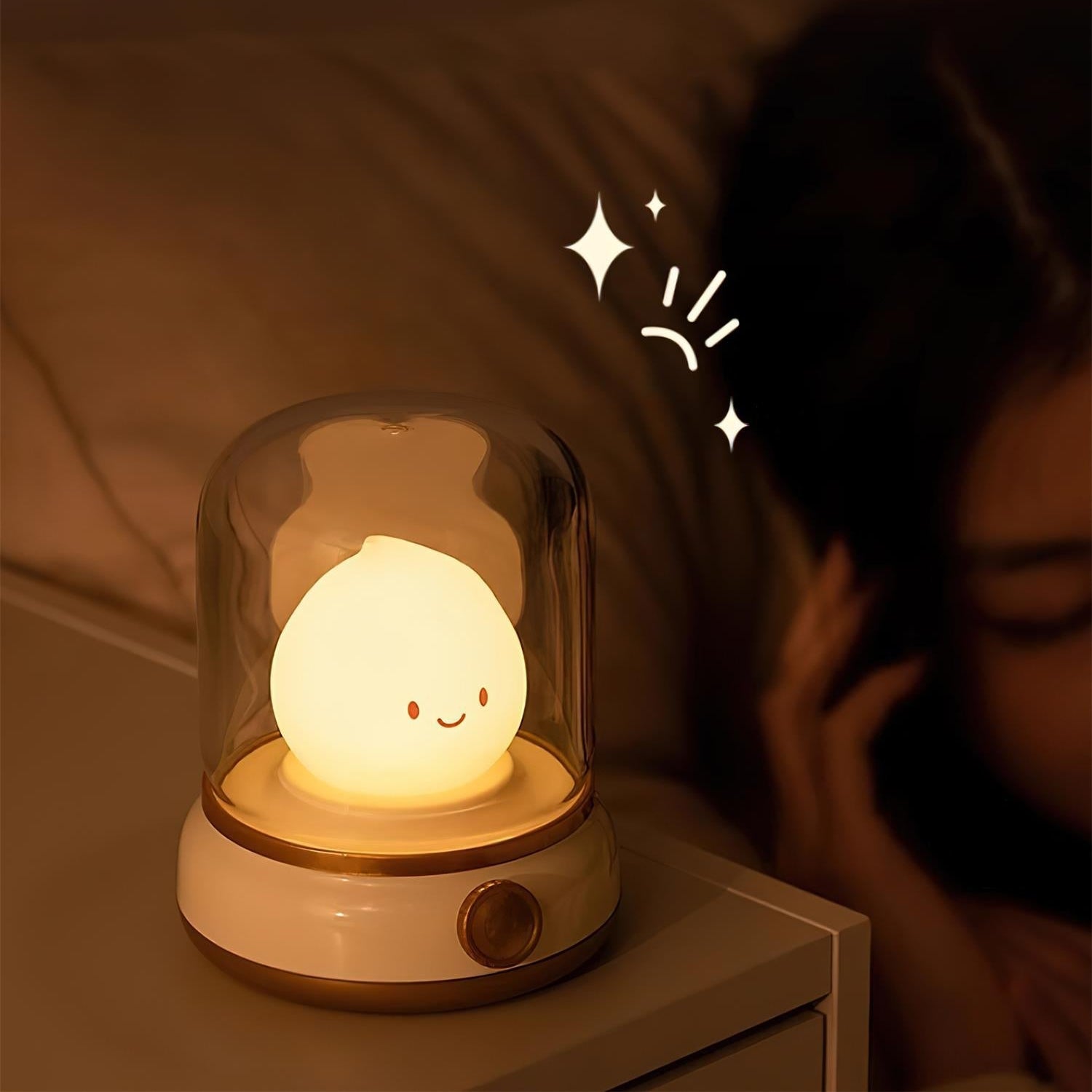 Cute night light with a smiling face on a bedside table, emitting a warm glow.