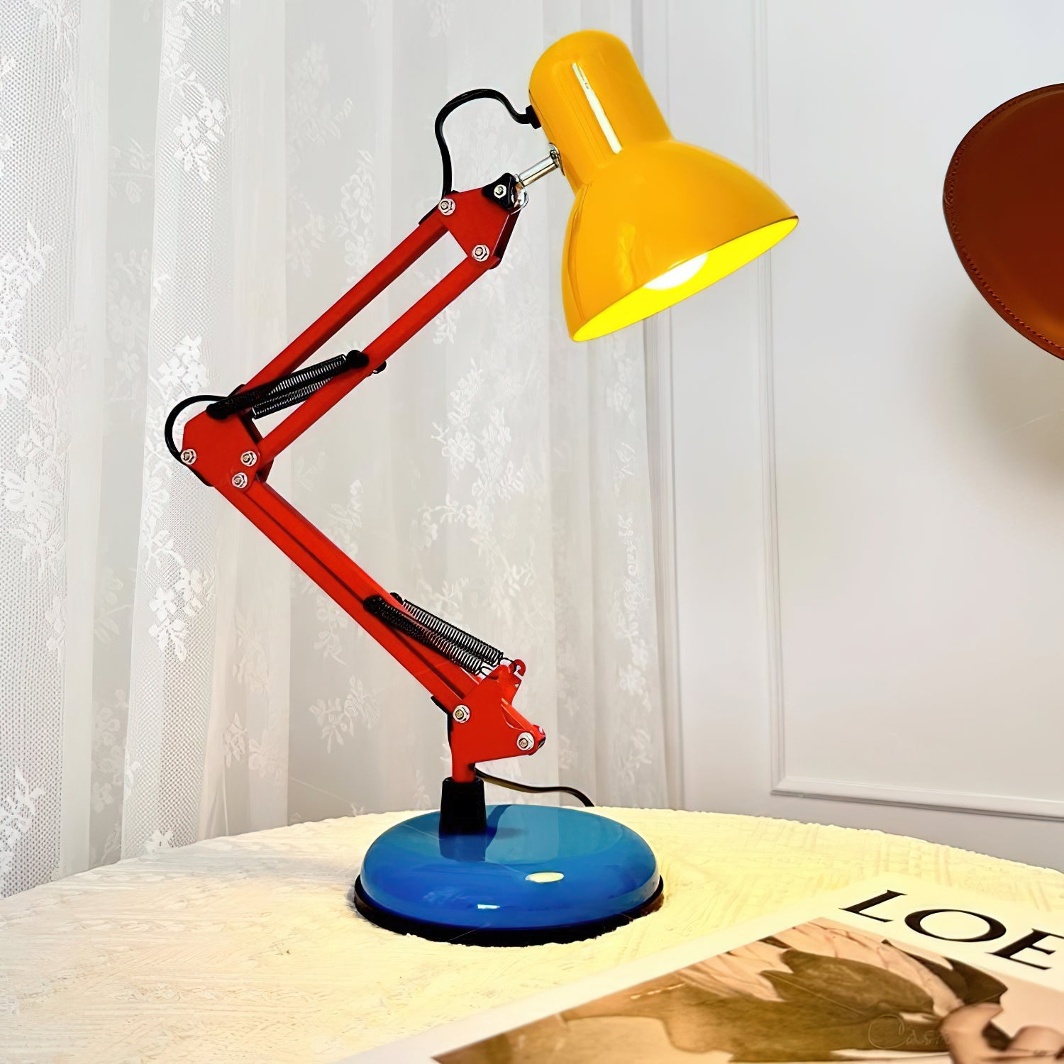 Colorful desk lamp with a yellow shade on a table