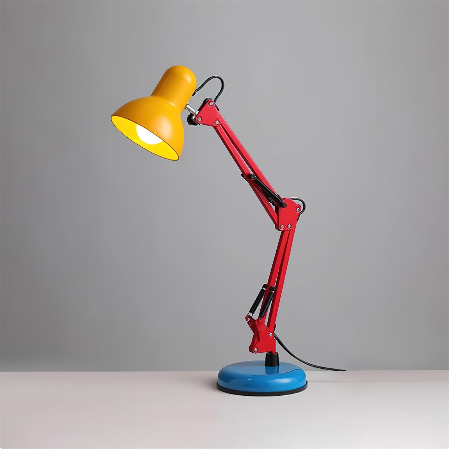 Colorful desk lamp with yellow shade, red arm, and blue base on a gray background
