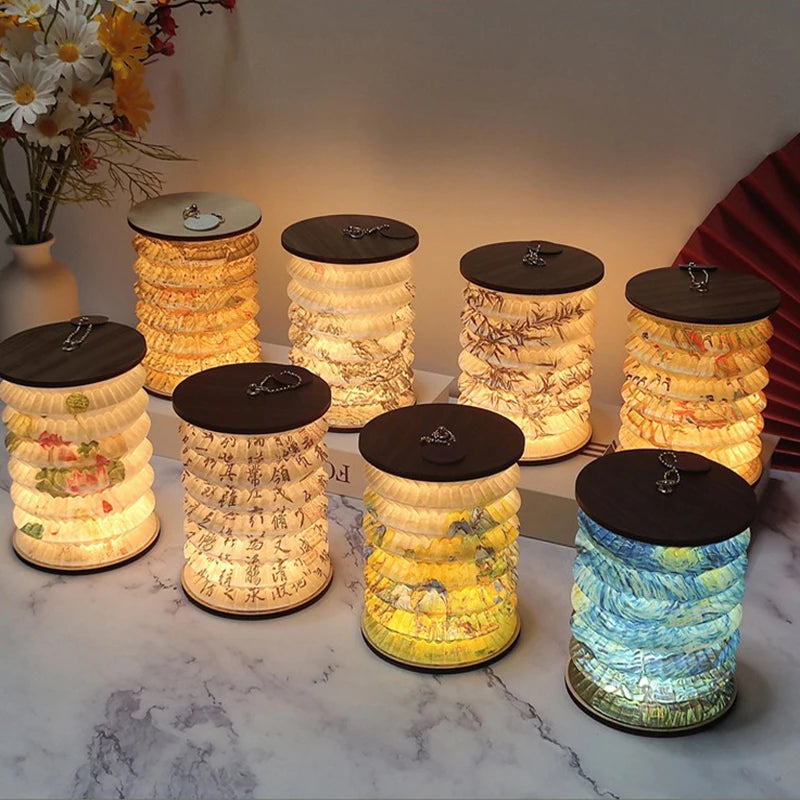 Set of decorative lamps with artistic designs on a marble surface.