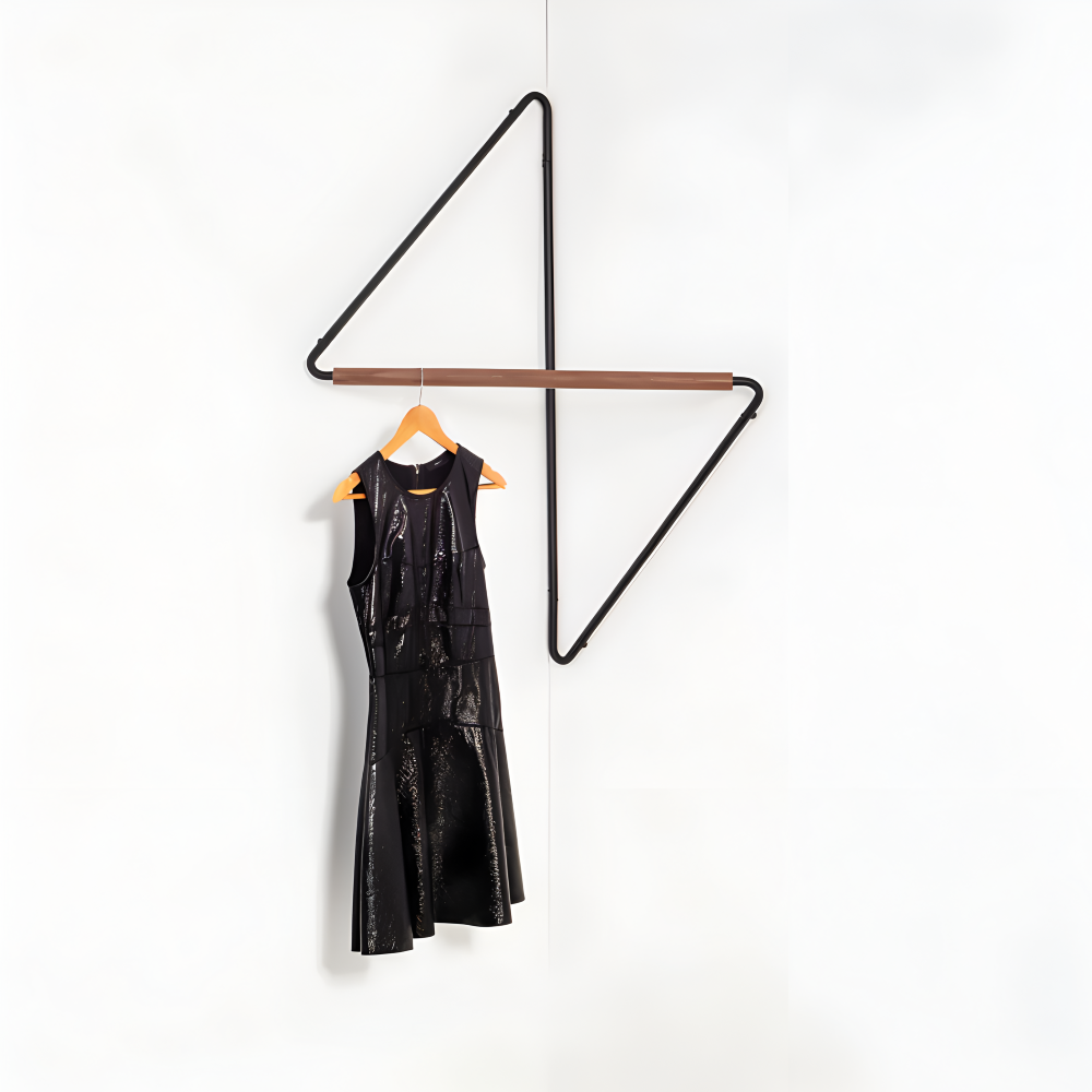 Black dress hanging on a modern black triangle-shaped hanger against a white background