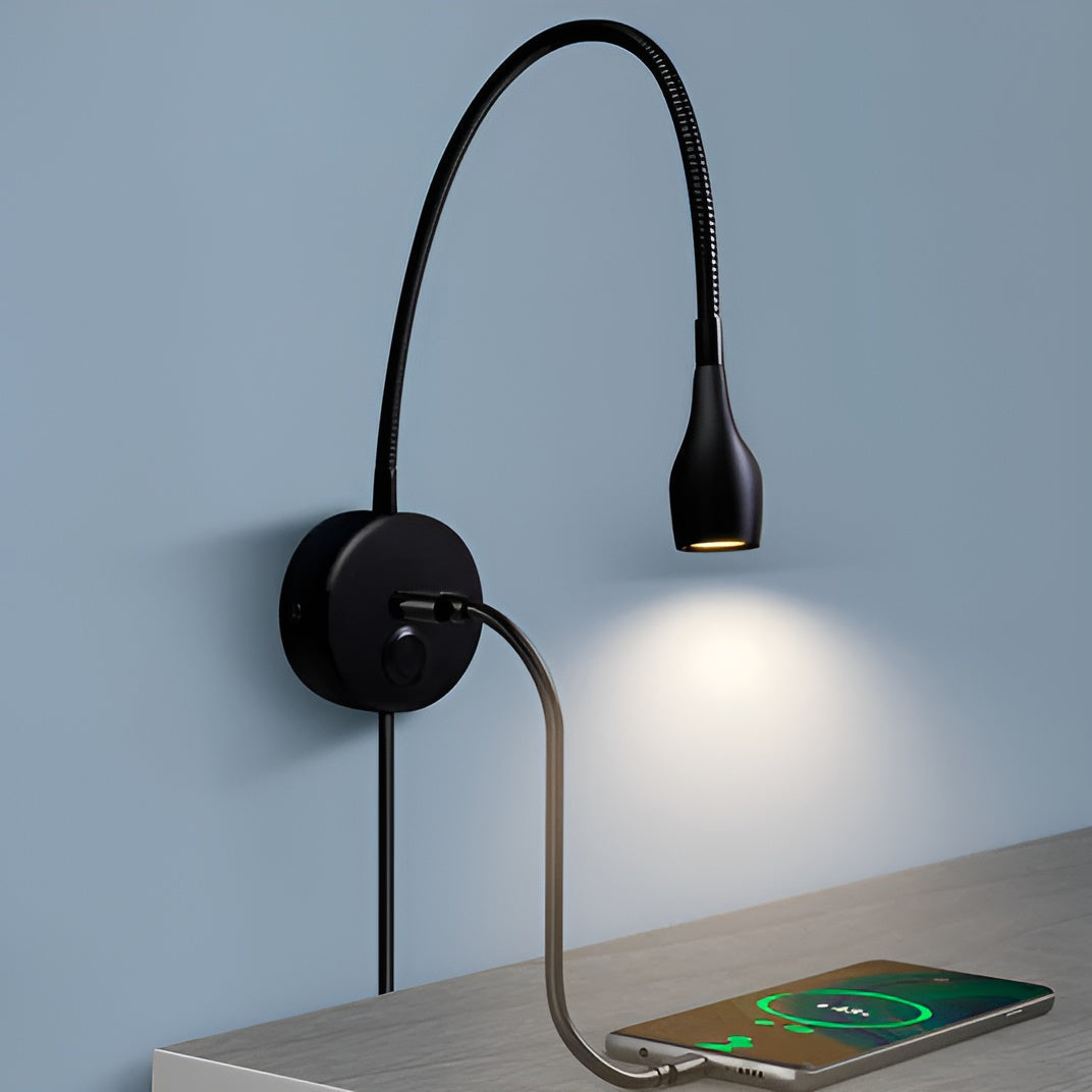 Black wall-mounted reading lamp with flexible neck on a light blue wall background.