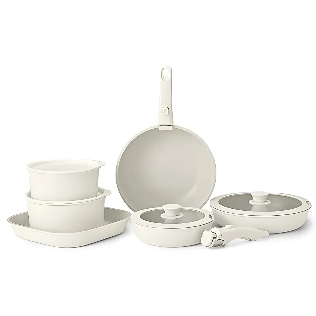 Set of ceramic cookware including pots, pans, and lids on a white background