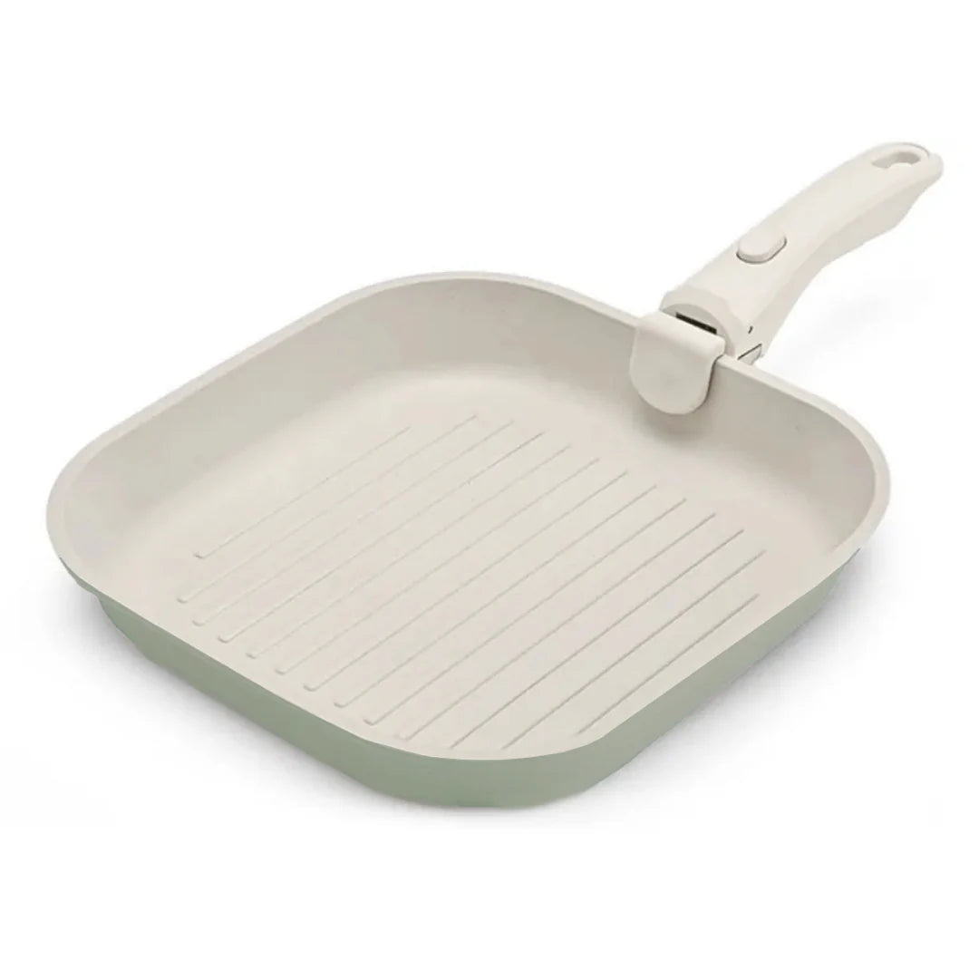 Green square frying pan with a white handle on a white background
