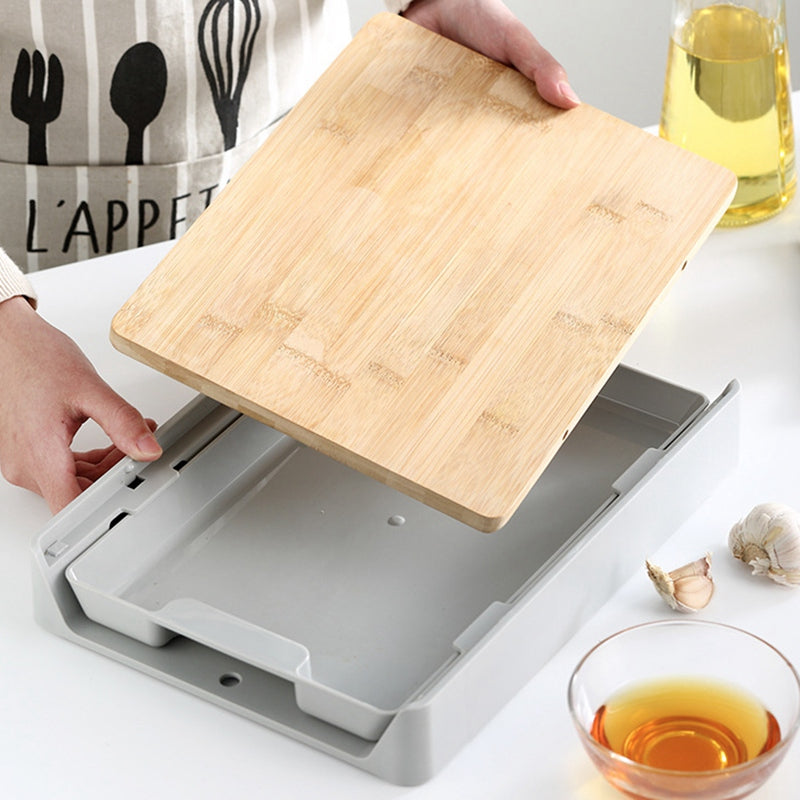 Wooden cutting board being placed into a gray stand on a kitchen counter.