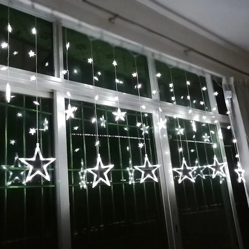 Star-shaped string lights hanging on a window