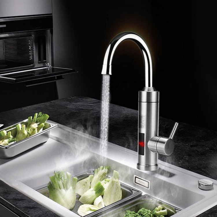 Modern kitchen faucet with water flowing into a sink containing vegetables.