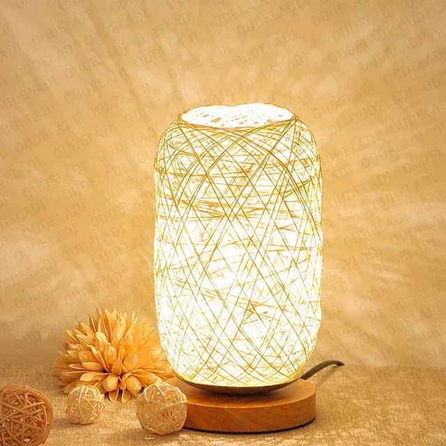 Woven lamp with warm glow on a beige background