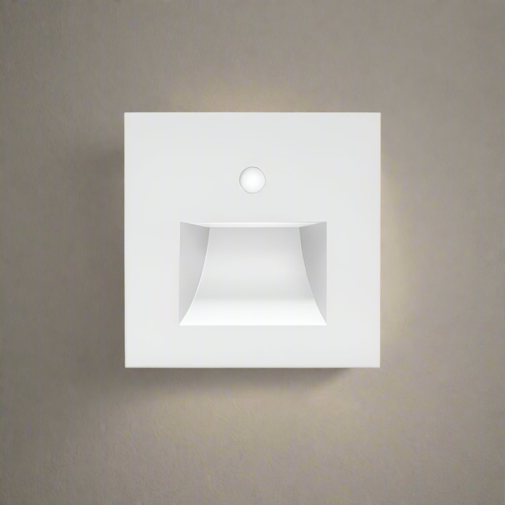 White square wall light fixture on a neutral gray wall