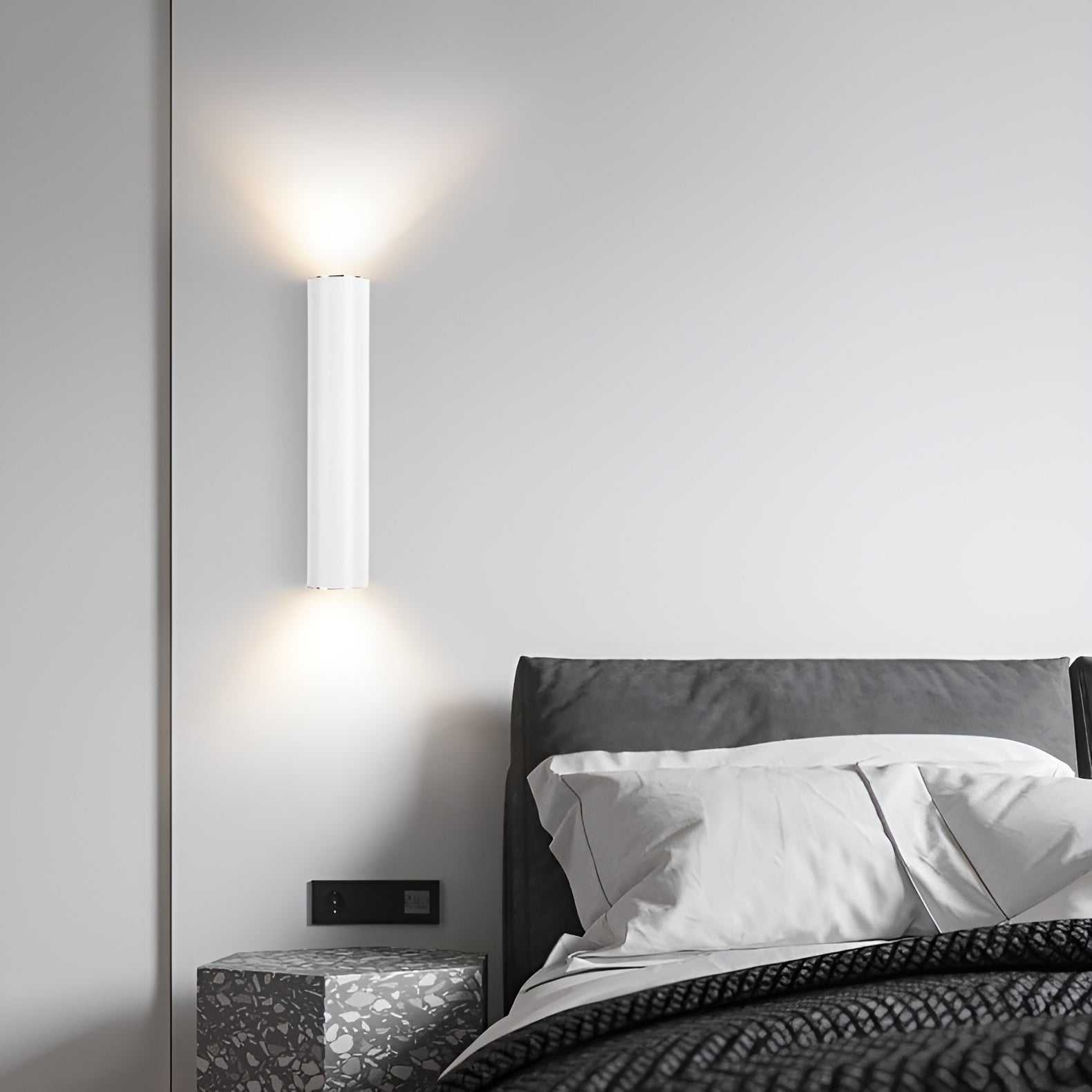 Modern wall-mounted light fixture in a bedroom setting.
