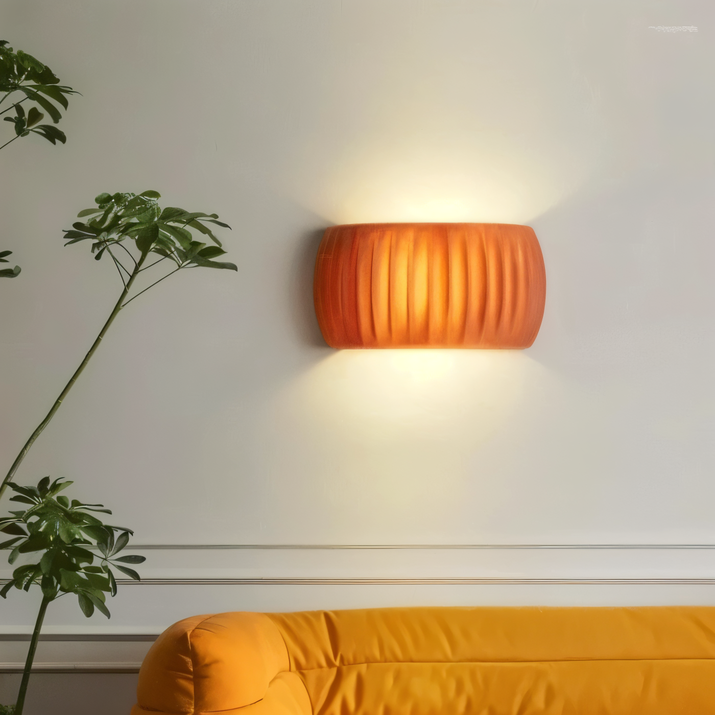 Orange wall lamp on a white wall with a plant and yellow sofa in the foreground