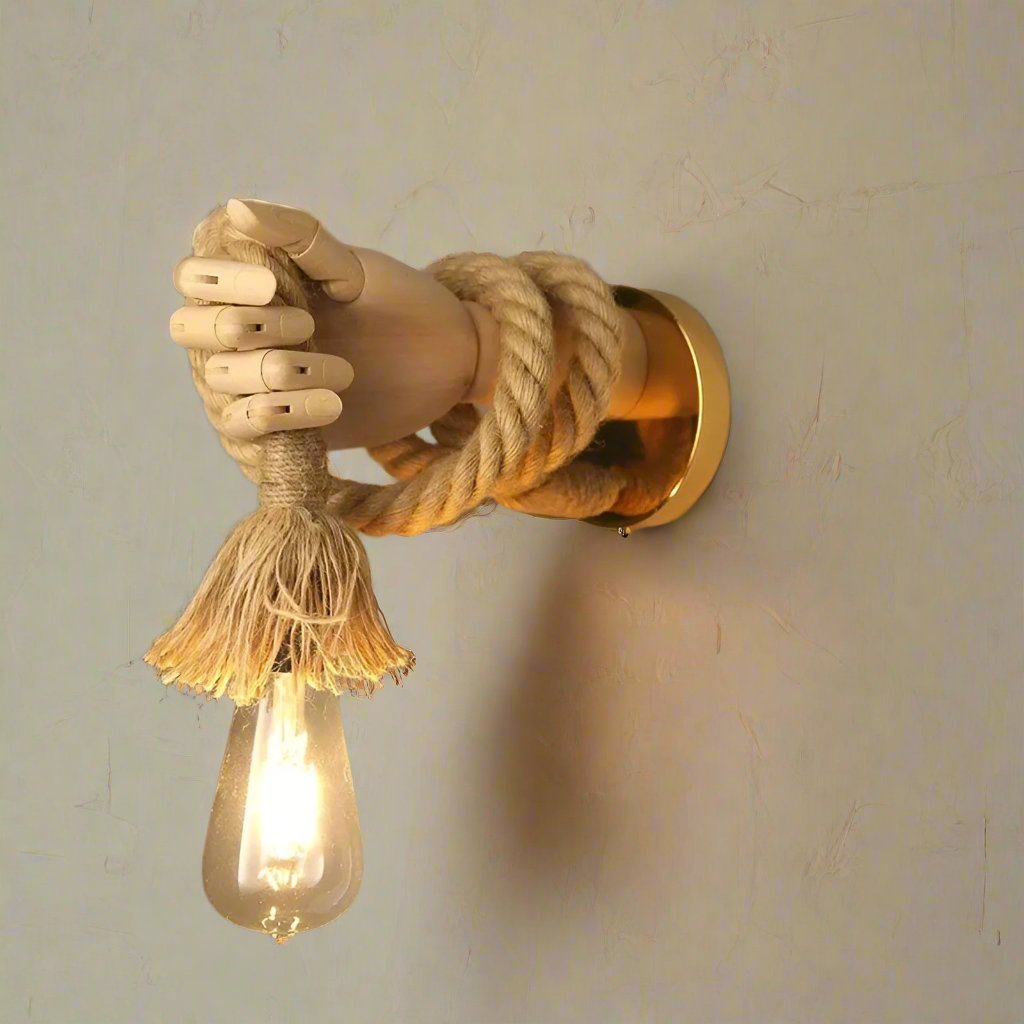 Wall-mounted light fixture with rope design on a plain wall