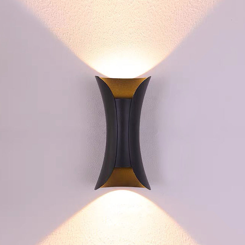 Modern wall-mounted light fixture on a plain wall