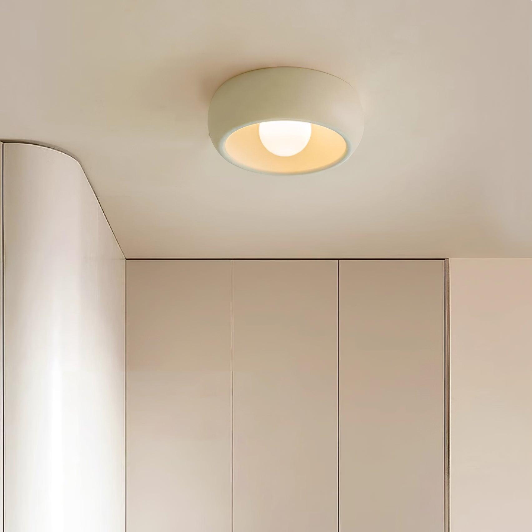Ceiling light fixture in a neutral-colored room