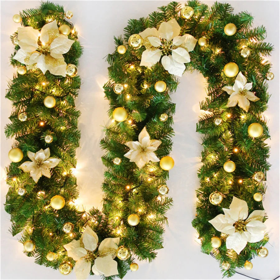 Decorative Christmas garland with lights and flowers on a white background