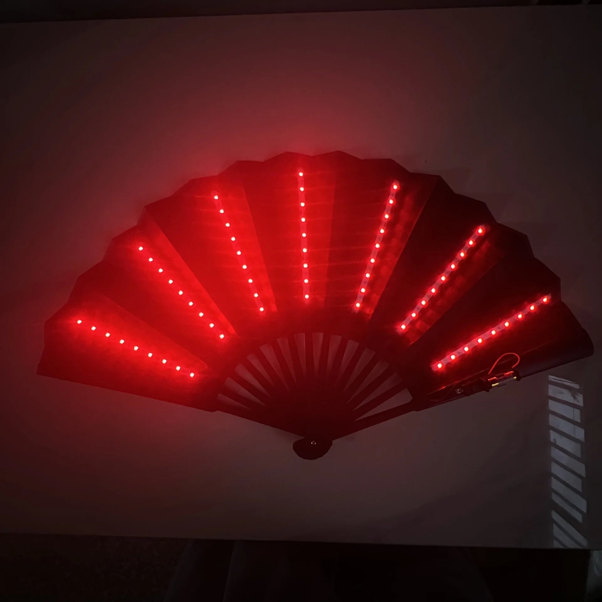 Red LED fan on a dark background
