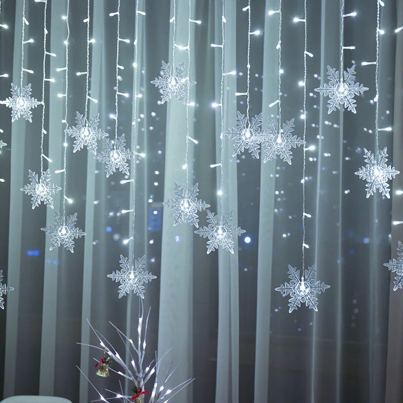 Decorative string lights shaped like snowflakes on a curtain against a dark background