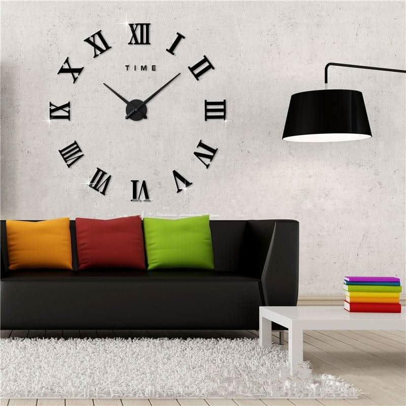 Living room with a large wall clock, colorful pillows, and a lamp.