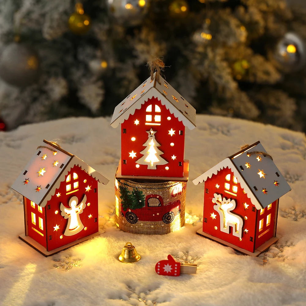 Decorative Christmas houses with lights on a snowy background