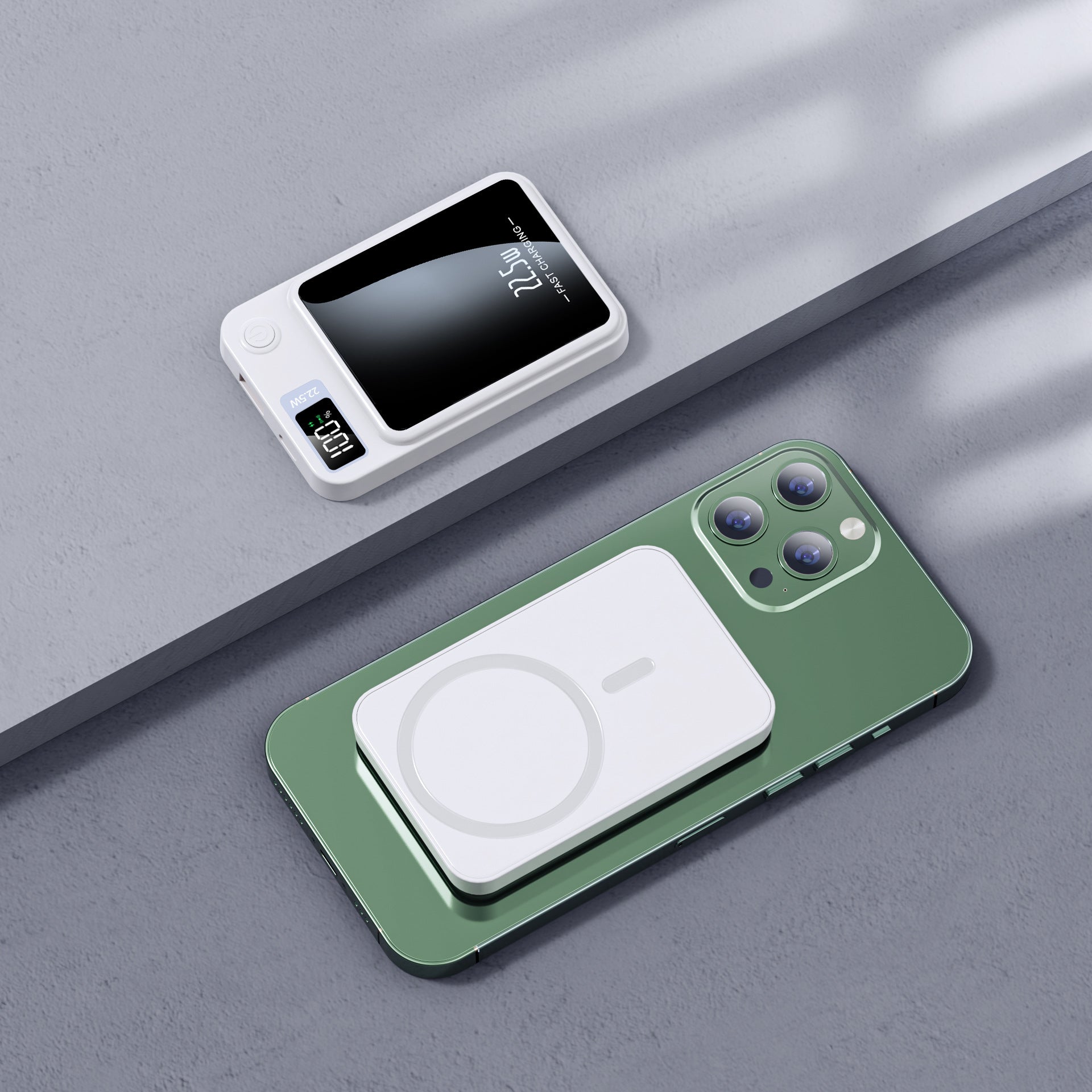 Green smartphone with a wireless charging pad on a gray surface