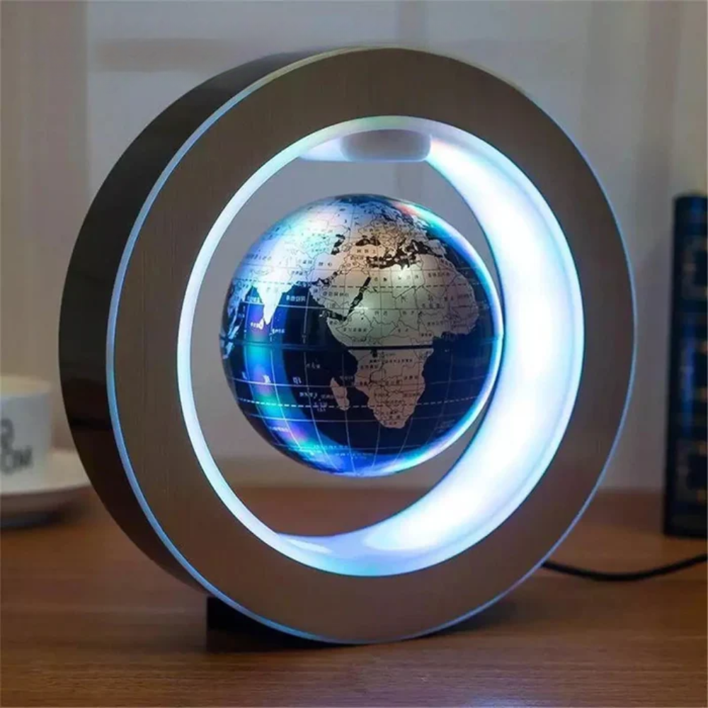 Levitating globe with LED lights on a wooden surface