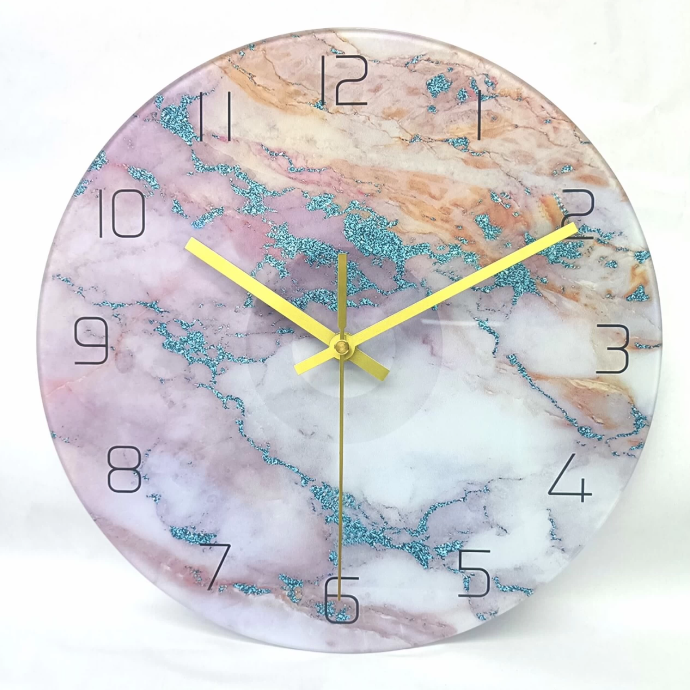 Marble-patterned wall clock with yellow hands on a white background