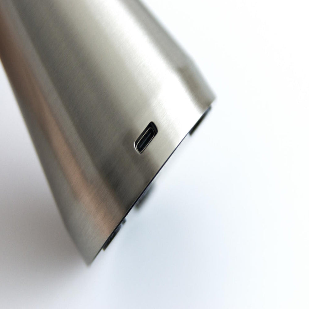 Close-up of a metallic phone case with USB-C port on a white background
