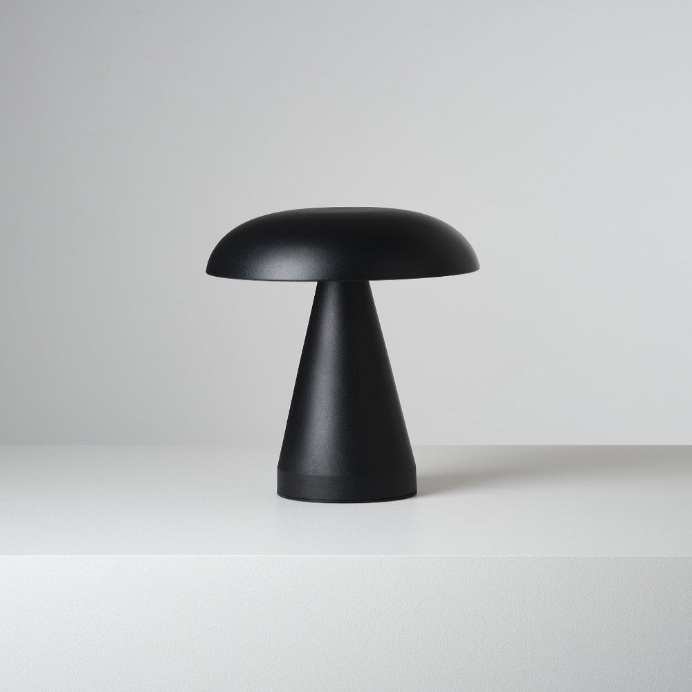 Black mushroom-shaped lamp on a white background