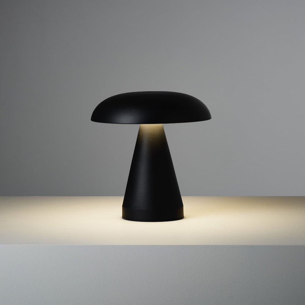 Black table lamp with a mushroom-shaped design on a gray background