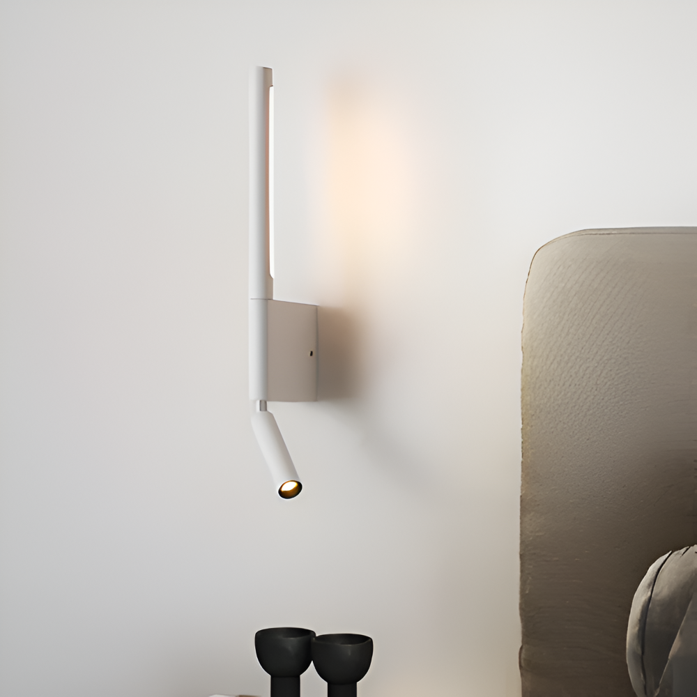 Modern wall-mounted light fixture on a neutral wall with a soft focus background.