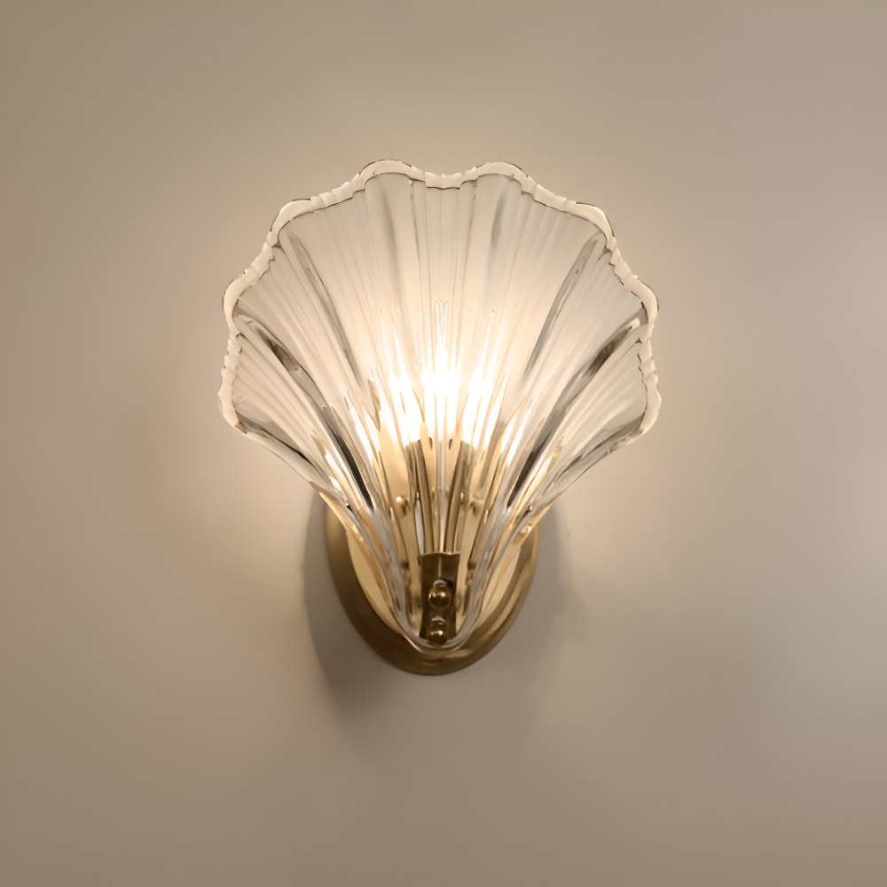 Shell-shaped wall light fixture on a neutral background