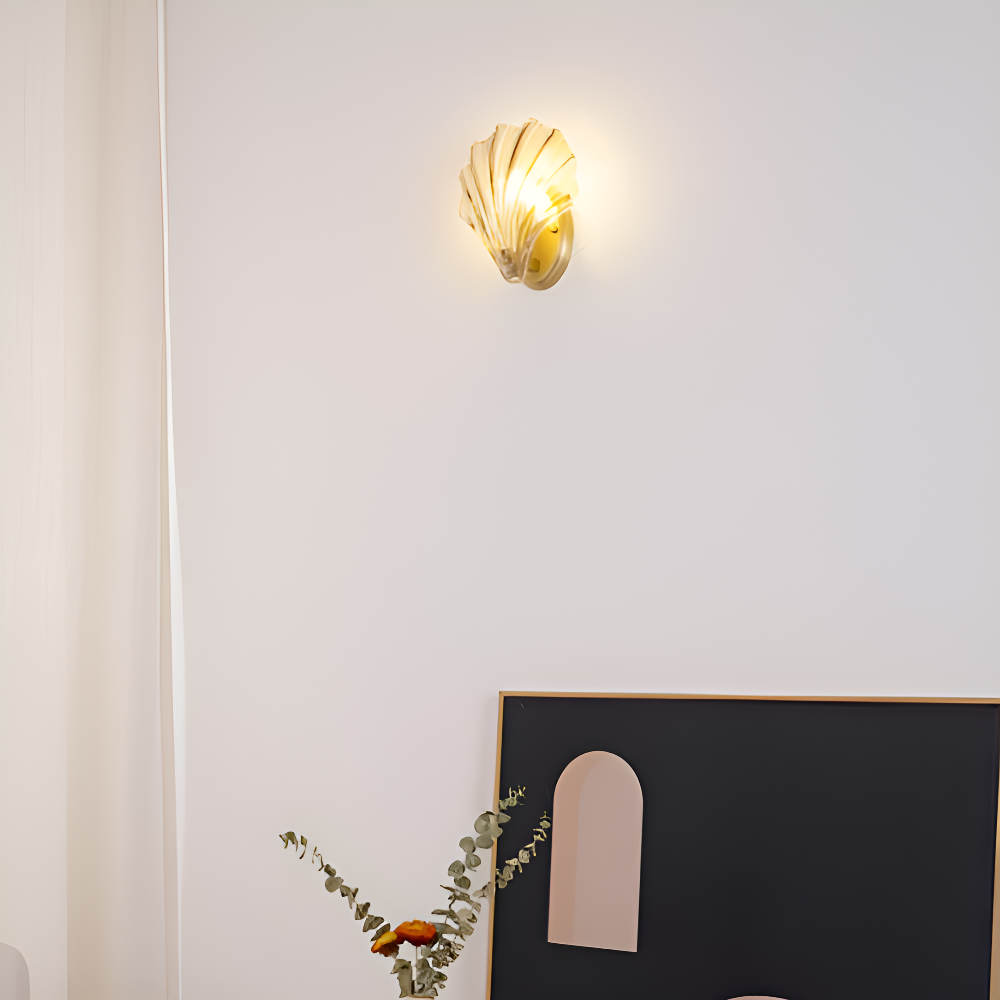 Wall-mounted light fixture on a white wall with a minimalistic decor setup.