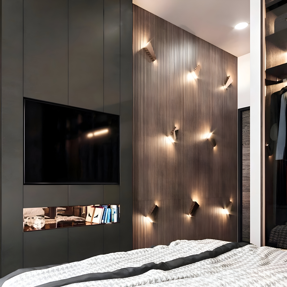 Modern bedroom with wooden wall, TV, and bed.