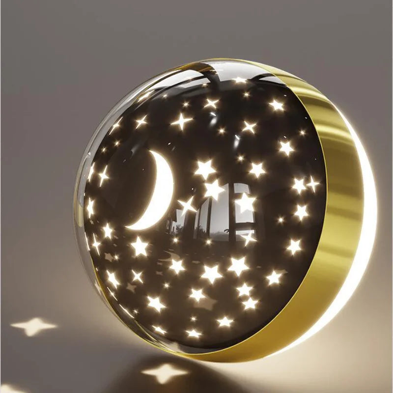 Decorative wall light with moon and star design on a gray background