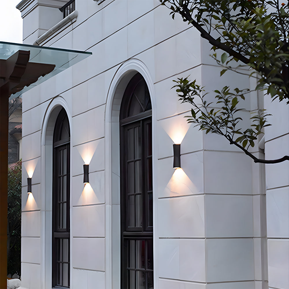 Modern outdoor wall lights on a white building facade