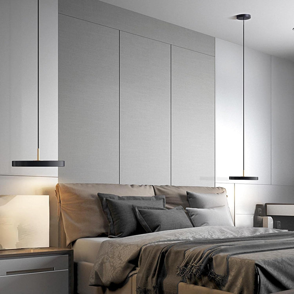 Modern bedroom with gray bedding and pendant lights